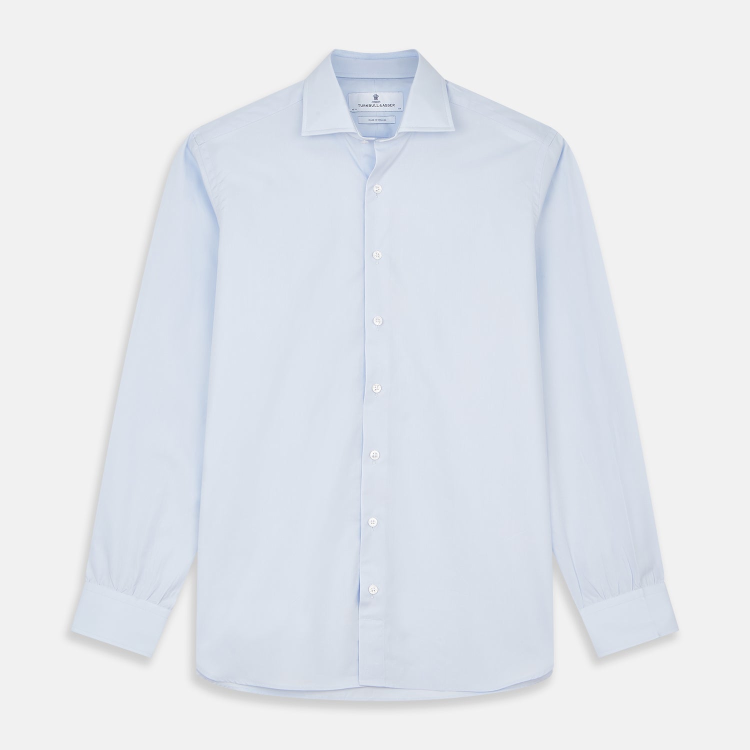 View 1 of product The Turnbull & Asser Tailored Fit Light Blue Cotton Shirt features a Kent collar, buttoned front, and 3-button cuffs, ideal for pairing with a navy suit and shown laid flat on a white background.