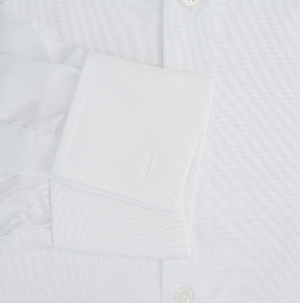 The Turnbull & Asser Tailored Fit White Royal Oxford Cotton Shirt features a Kent collar, double cuffs, and front buttons, shown on a clean white background.