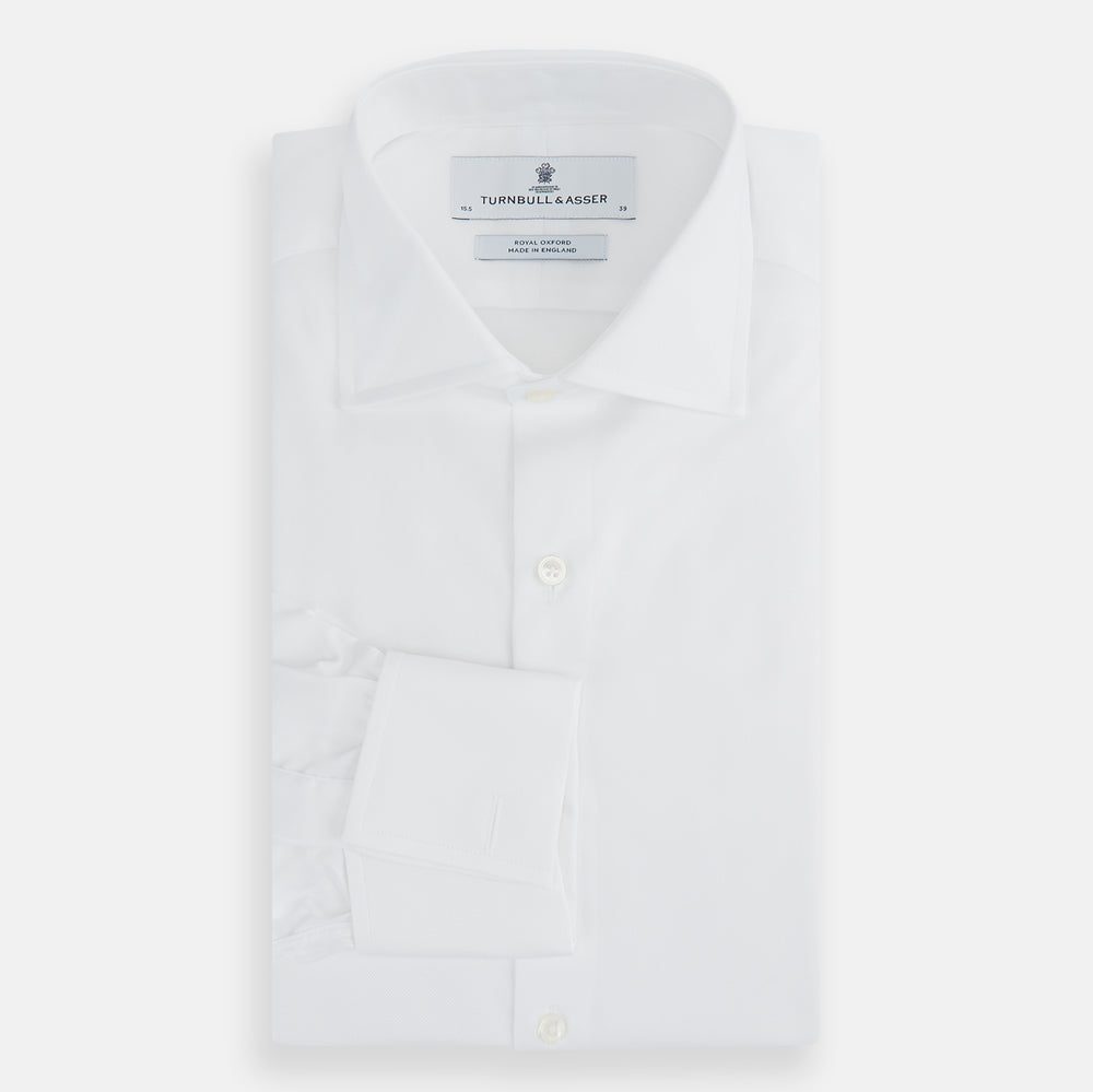 The Turnbull & Asser Tailored Fit White Royal Oxford Cotton Shirt features a Kent collar, double cuffs, and front buttons, shown on a clean white background.