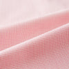 View 6 of product The Turnbull & Asser UK CORAL COTTON MINI CHECKED SHIRT is a light pink long-sleeve button-up shirt with a Kent collar, white buttons, and three-button cuffs, shown on a plain white background.