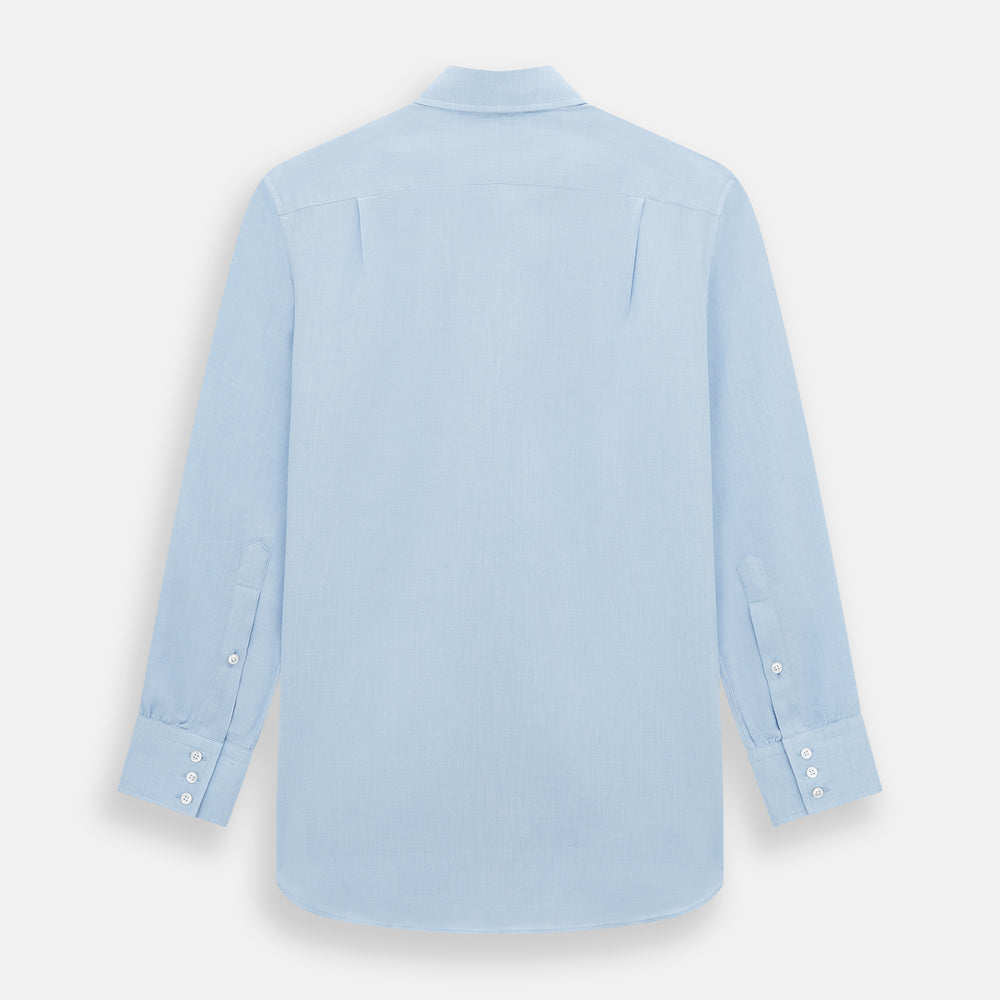The Turnbull & Asser Tailored Fit Blue Cotton Cashmere Belgravia Shirt features a classic collar, button-down front, and buttoned cuffs, shown laid flat on a white background for a refined, formal look.