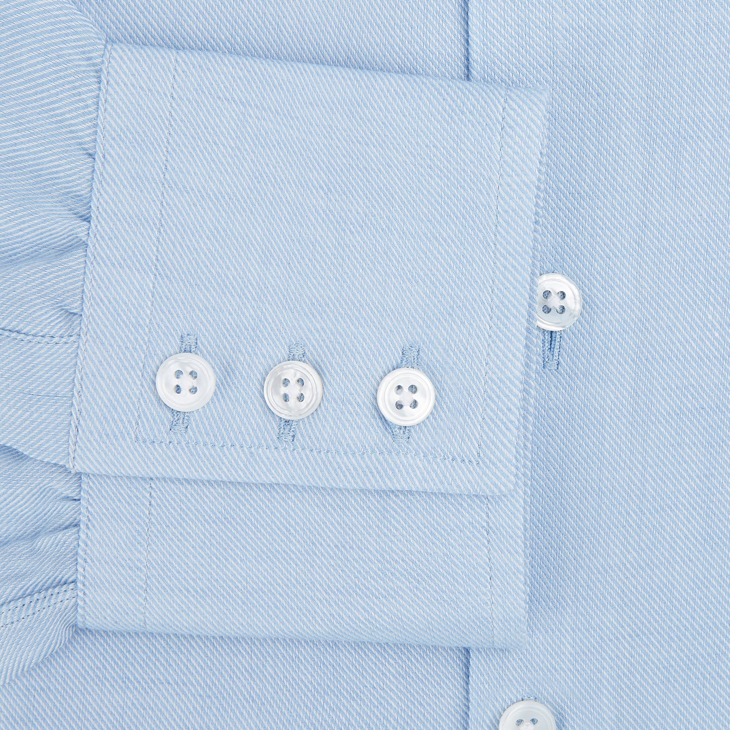 View 4 of product The Turnbull & Asser Tailored Fit Blue Cotton Cashmere Belgravia Shirt features a classic collar, button-down front, and buttoned cuffs, shown laid flat on a white background for a refined, formal look.