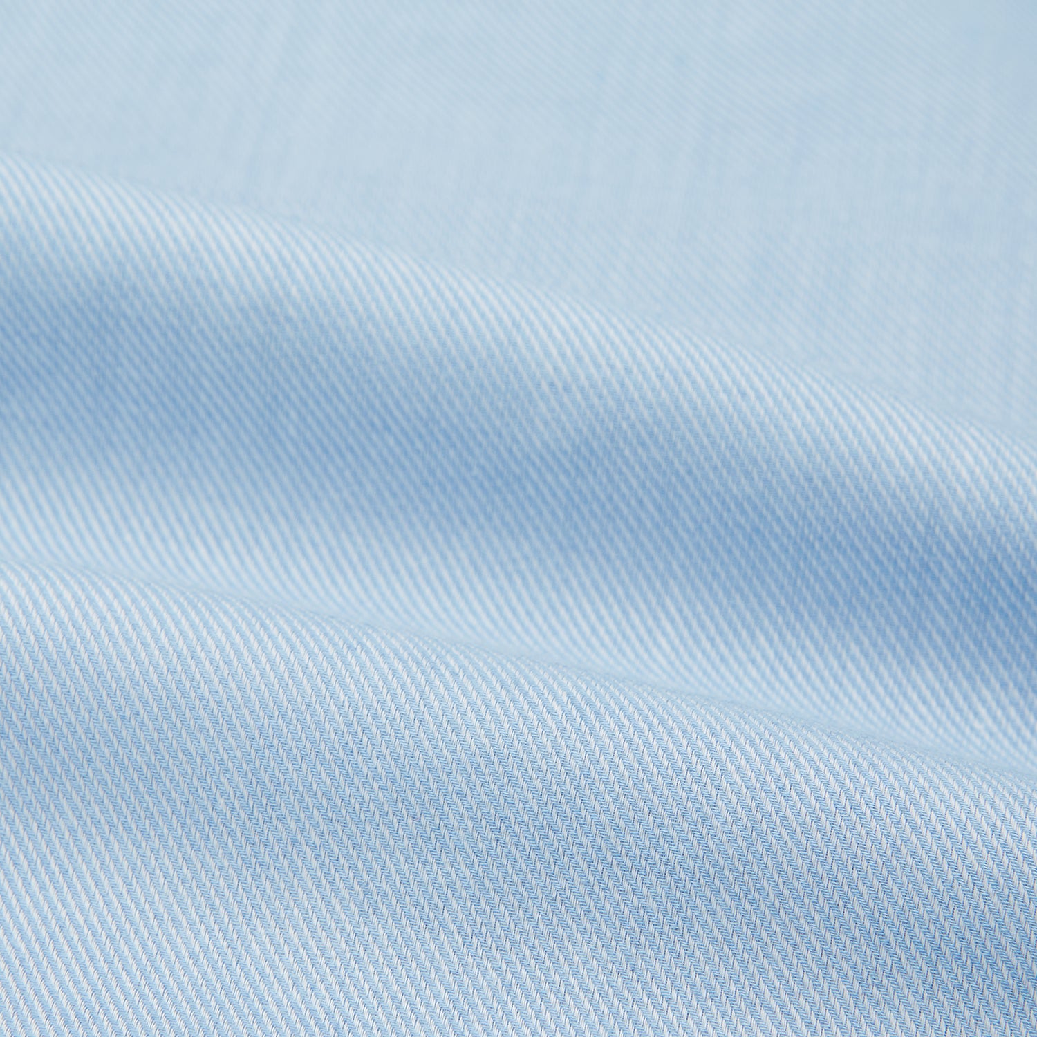 View 6 of product The Turnbull & Asser Tailored Fit Blue Cotton Cashmere Belgravia Shirt features a classic collar, button-down front, and buttoned cuffs, shown laid flat on a white background for a refined, formal look.