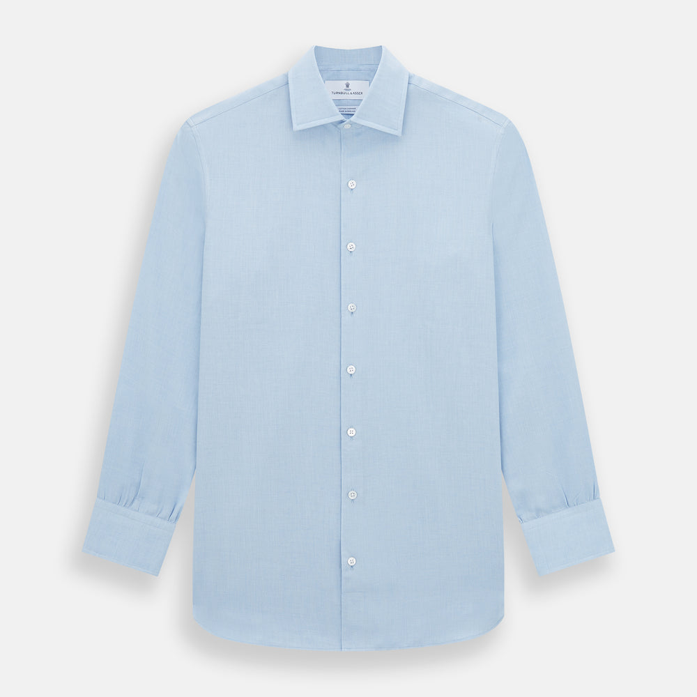 The Turnbull & Asser Tailored Fit Blue Cotton Cashmere Belgravia Shirt features a classic collar, button-down front, and buttoned cuffs, shown laid flat on a white background for a refined, formal look.