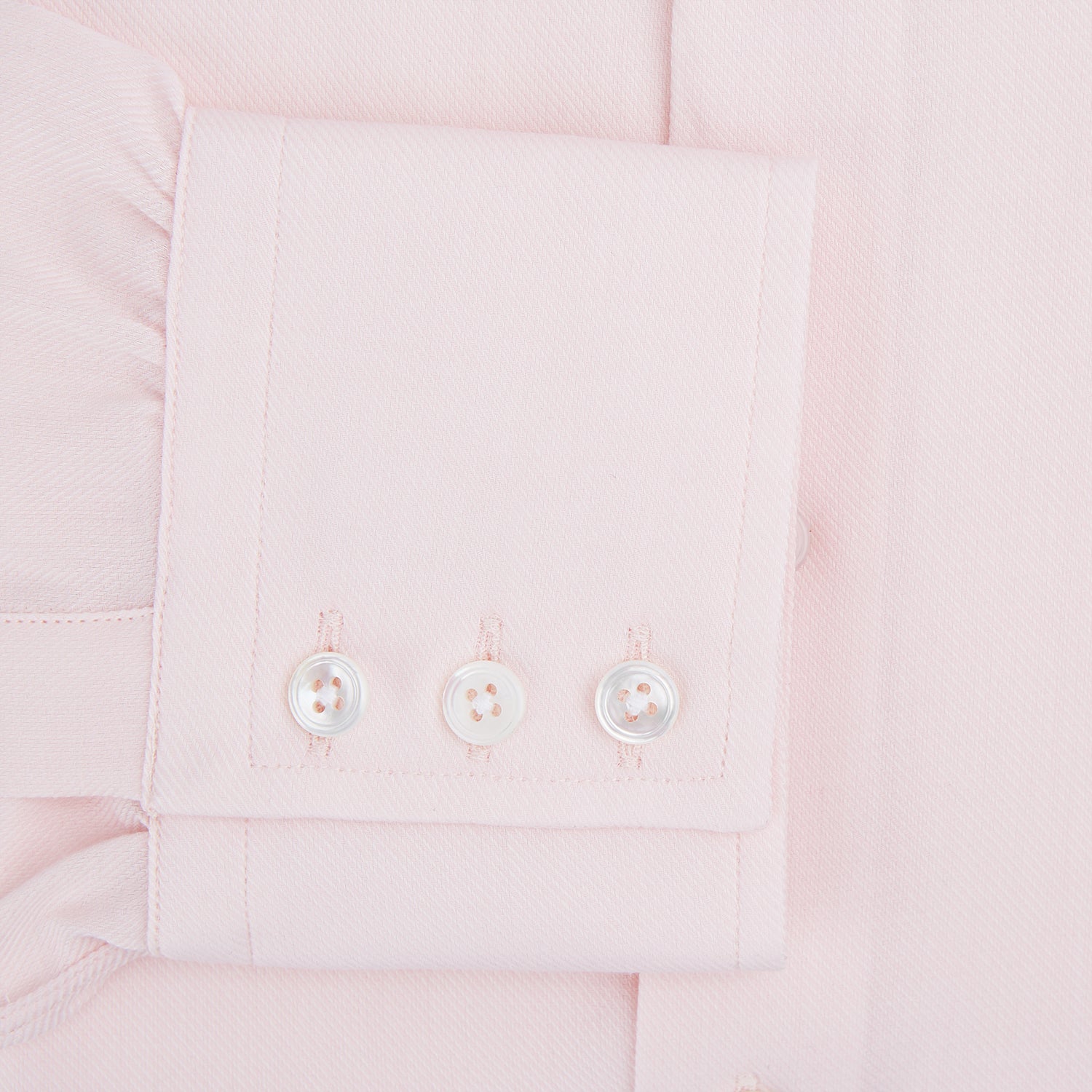 View 4 of product The Turnbull & Asser Tailored Fit Pale Pink Cotton Cashmere Belgravia Shirt features long sleeves and a collar for a formal look, shown flat against a white background.