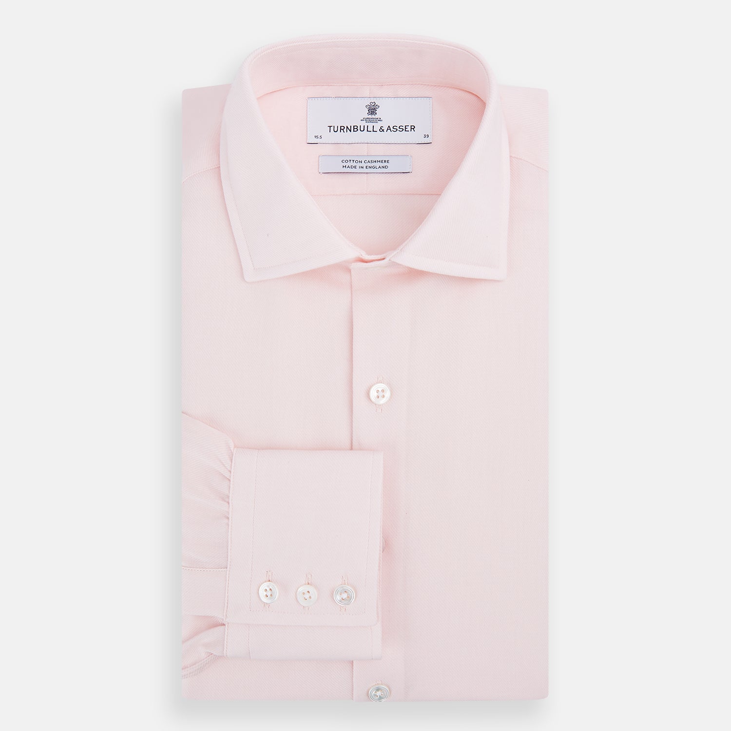 View 5 of product The Turnbull & Asser Tailored Fit Pale Pink Cotton Cashmere Belgravia Shirt features long sleeves and a collar for a formal look, shown flat against a white background.