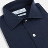 View 2 of product The Turnbull & Asser Tailored Fit Navy Cotton Cashmere Belgravia Shirt features a classic collar, white buttons, and long sleeves, shown on a white background.