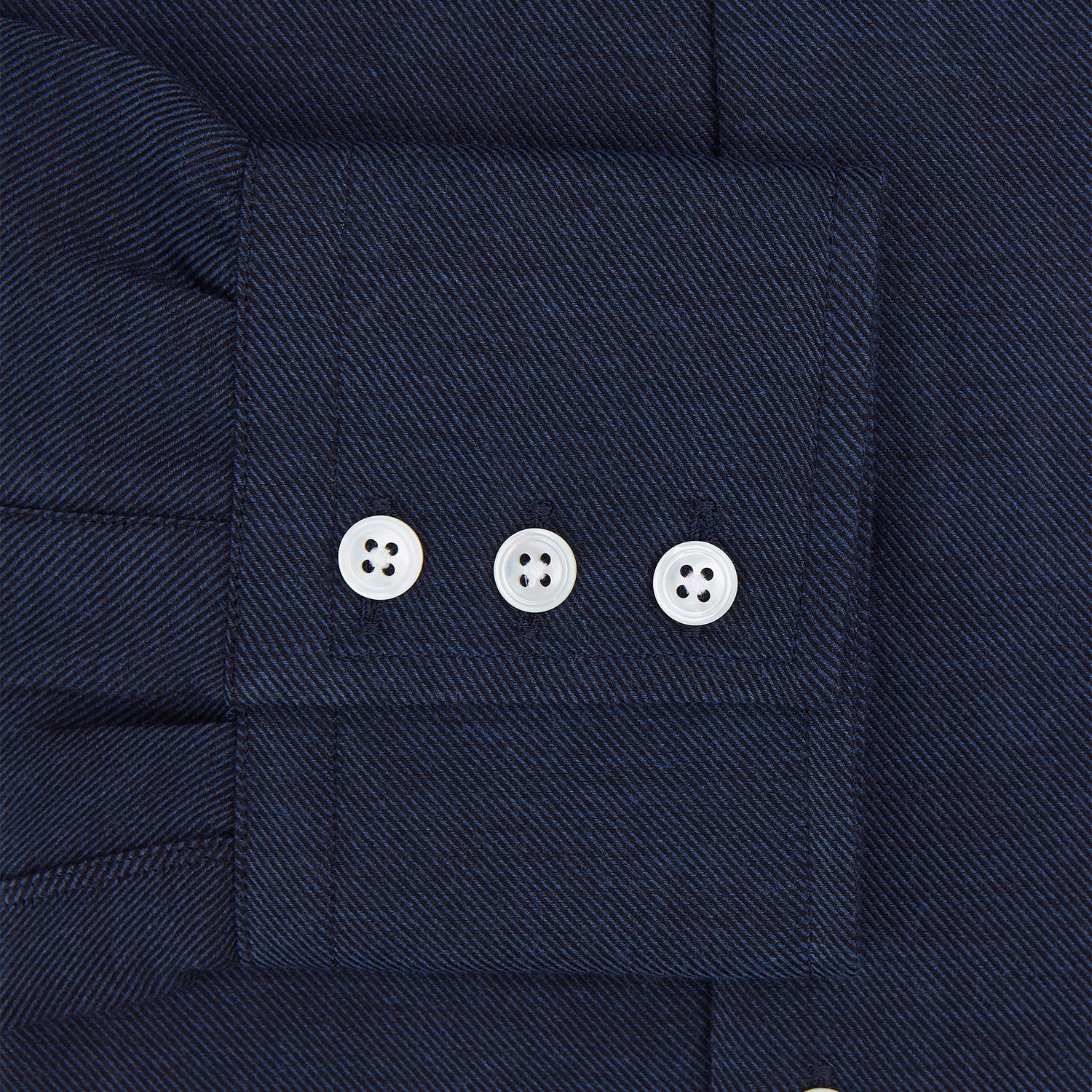 View 4 of product The Turnbull & Asser Tailored Fit Navy Cotton Cashmere Belgravia Shirt features a classic collar, white buttons, and long sleeves, shown on a white background.