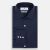 View 5 of product The Turnbull & Asser Tailored Fit Navy Cotton Cashmere Belgravia Shirt features a classic collar, white buttons, and long sleeves, shown on a white background.