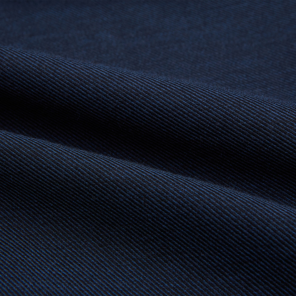 The Turnbull & Asser Tailored Fit Navy Cotton Cashmere Belgravia Shirt features a classic collar, white buttons, and long sleeves, shown on a white background.