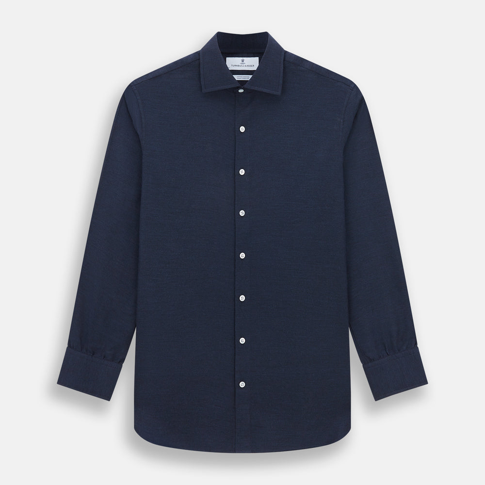 The Turnbull & Asser Tailored Fit Navy Cotton Cashmere Belgravia Shirt features a classic collar, white buttons, and long sleeves, shown on a white background.