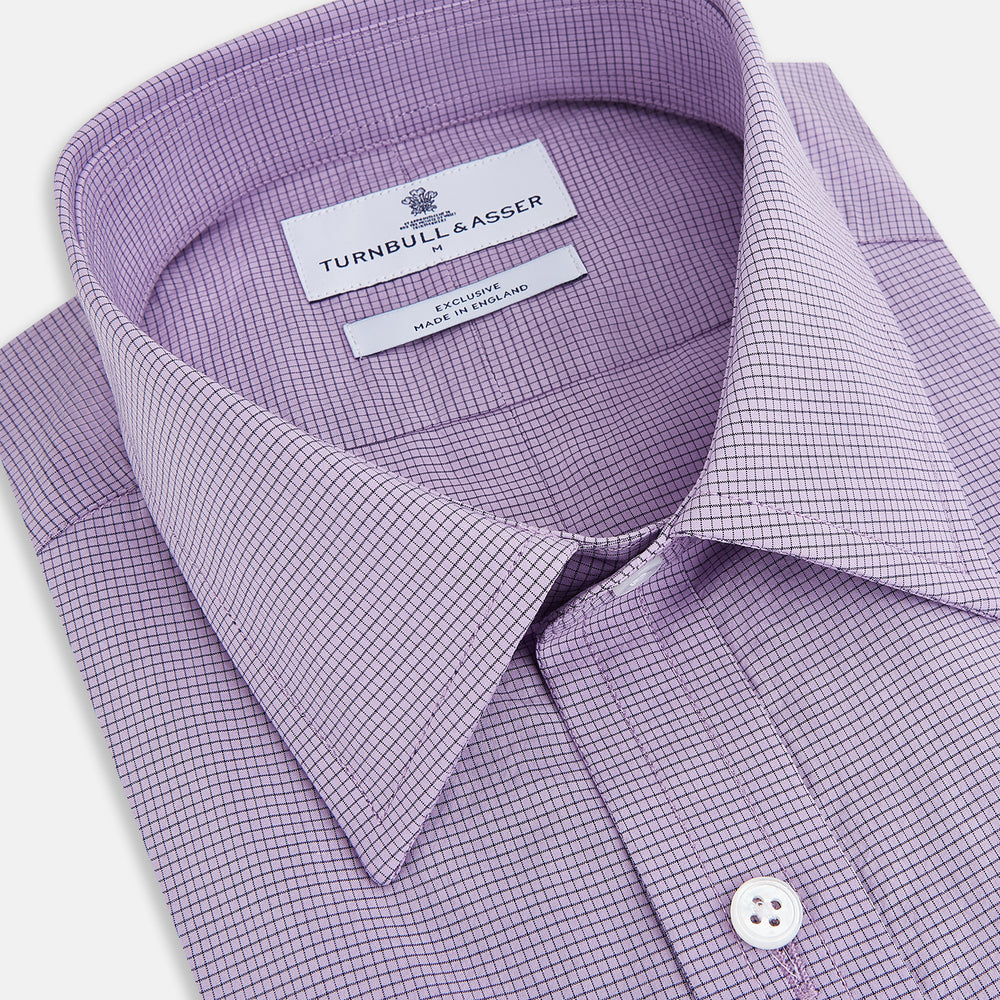 Turnbull & Asser UK SHIRTS WF DERBY COLLAR 1BC 1PKT BABY PINK/NAVY CHK long-sleeved shirt featuring a baby pink and navy check pattern, a button-down front, a single chest pocket, and button cuffs.