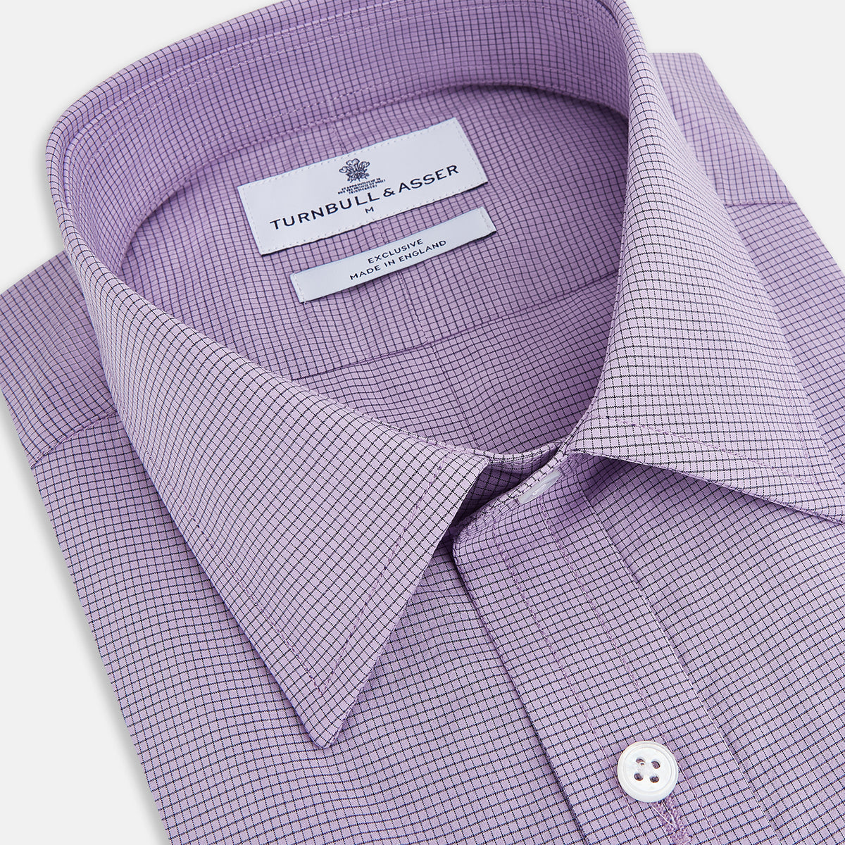 View 2 of product Turnbull & Asser UK SHIRTS WF DERBY COLLAR 1BC 1PKT BABY PINK/NAVY CHK long-sleeved shirt featuring a baby pink and navy check pattern, a button-down front, a single chest pocket, and button cuffs.