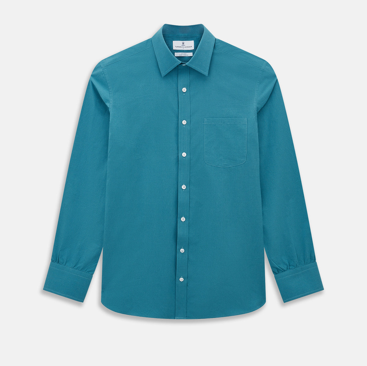 View 1 of product Here’s a rewritten version using your product data: The Turnbull & Asser UK Fine Checked Turquoise Blue Weekend Fit Shirt in Cotton is a men’s long-sleeve button-up, featuring a chest pocket, white buttons, and a pointed collar, shown laid flat against a white background.