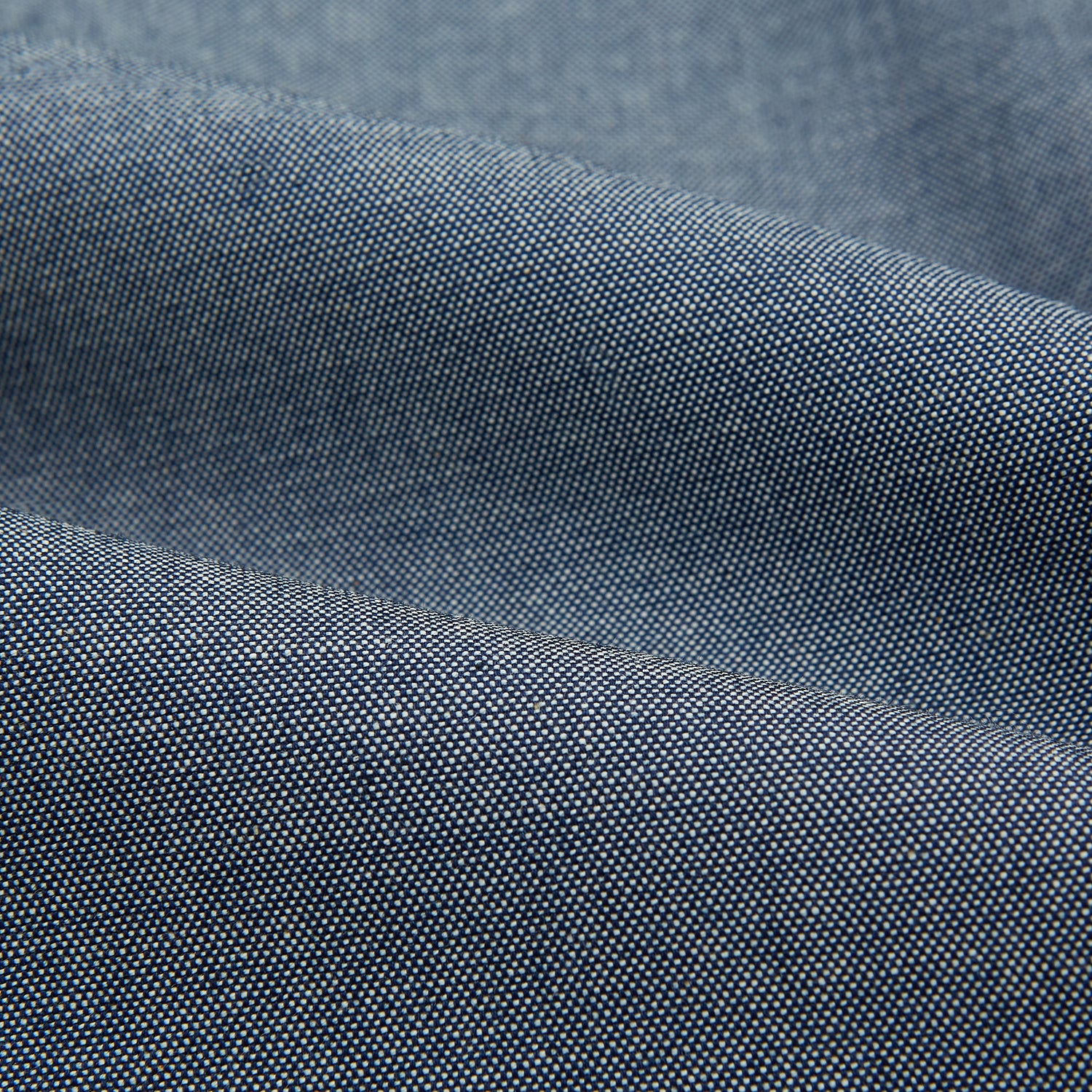 View 6 of product The Turnbull & Asser Steel Blue Richmond Shirt is a long-sleeved, button-up dress shirt with a Derby collar, single chest pocket, and buttoned cuffs—shown on a plain white background.