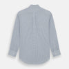 View 5 of product The Turnbull & Asser Blue Double Graph Check Richmond Shirt features a light blue and white check pattern, front pocket, Derby collar, buttoned cuffs, and long sleeves, shown laid flat on a white background.