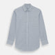 The Turnbull & Asser Blue Double Graph Check Richmond Shirt features a light blue and white check pattern, front pocket, Derby collar, buttoned cuffs, and long sleeves, shown laid flat on a white background.