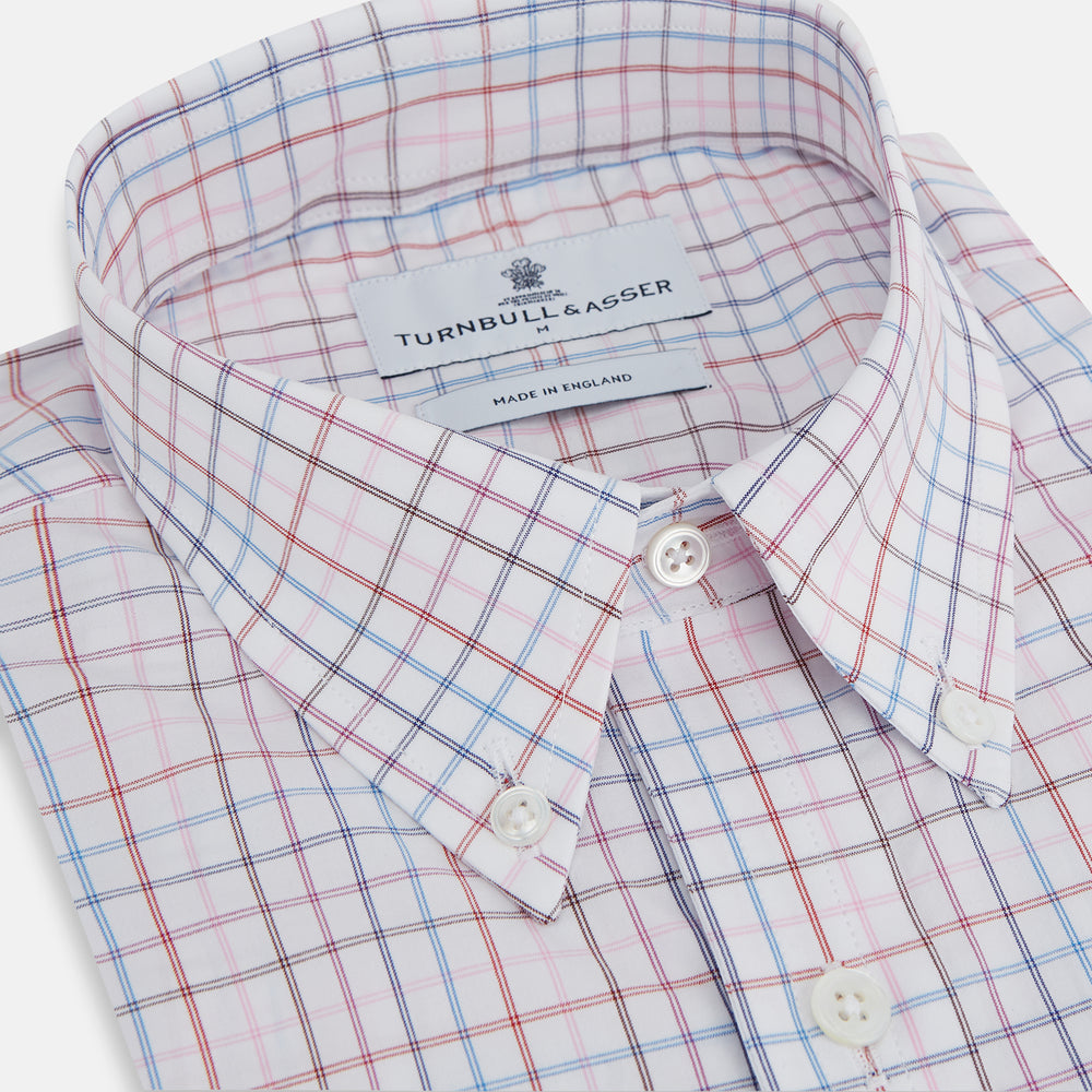 The Turnbull & Asser Multi Graph Check Richmond Shirt features a white base with red and blue checks, a Dorset button-down collar, and long sleeves. The shirt is displayed neatly on a plain white background.