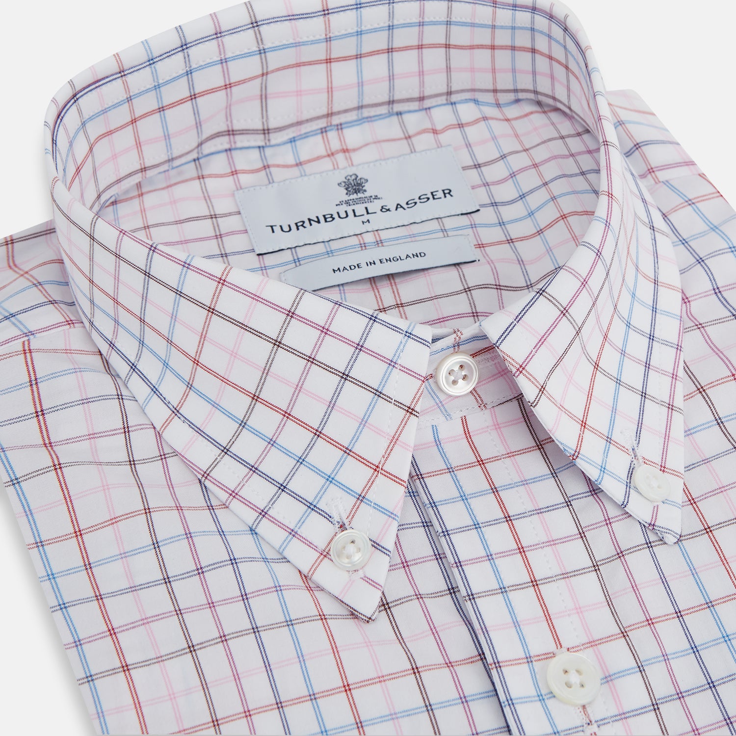 View 2 of product The Turnbull & Asser Multi Graph Check Richmond Shirt features a white base with red and blue checks, a Dorset button-down collar, and long sleeves. The shirt is displayed neatly on a plain white background.
