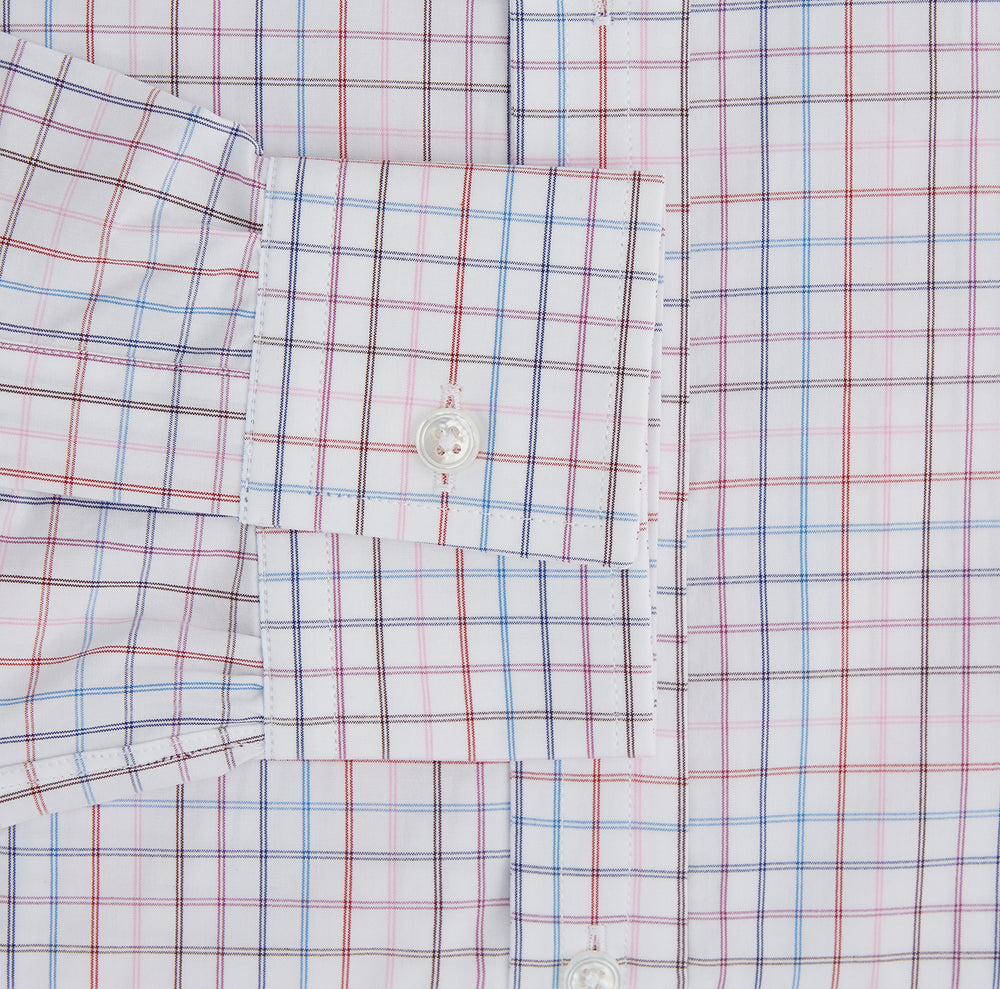 The Turnbull & Asser Multi Graph Check Richmond Shirt features a white base with red and blue checks, a Dorset button-down collar, and long sleeves. The shirt is displayed neatly on a plain white background.