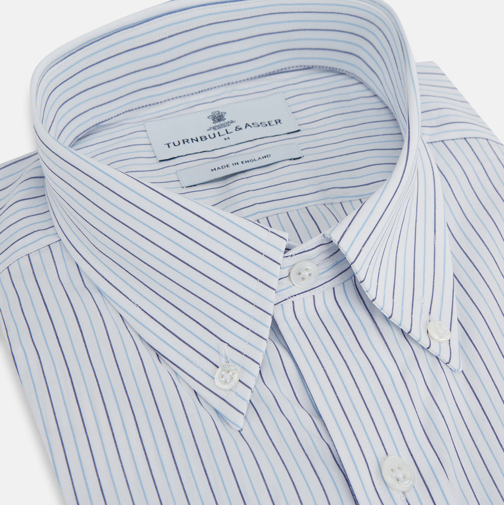 The Blue Double Pinstripe Richmond Shirt by Turnbull & Asser, featuring long sleeves, buttoned cuffs, and a button-down collar, is laid flat on a white background.