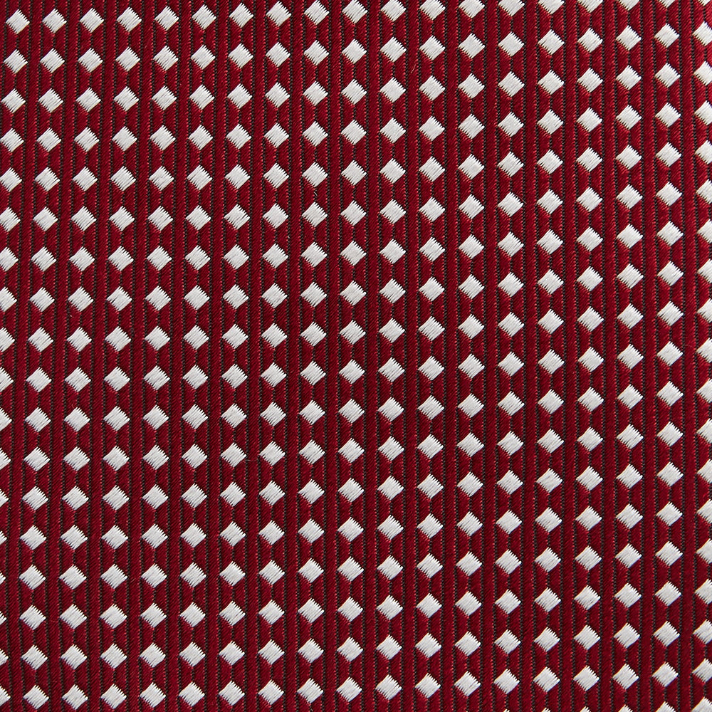 The Turnbull & Asser Slim Burgundy and White Diamond Silk Tie, shown rolled on a white background, features a repeating pattern of small white diamonds—an ideal accessory to complement any office shirt.
