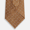 View 3 of product The Turnbull & Asser Camel and White Small Spot Herringbone Silk Tie features a stylish herringbone pattern with white spots—an elegant accessory ideal for modern office attire.