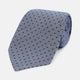 The Turnbull & Asser Navy and Pale Blue Micro Dot Silk Tie features a pattern of small, evenly spaced dots and is elegantly rolled on a plain white background.