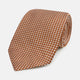 The Turnbull & Asser Brown and White Diamond Silk Tie features a repeating small geometric pattern and is displayed rolled up on a plain white background.