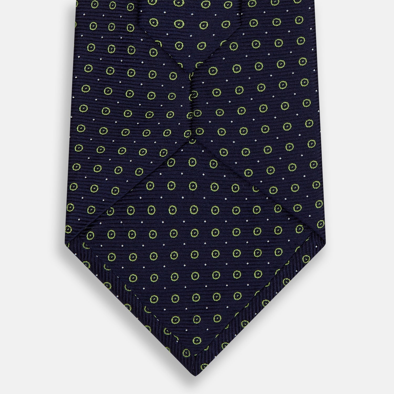 View 3 of product The Turnbull & Asser Navy and Light Green Circle Silk Tie features a navy base with small light green circular patterns, crafted from fine silk.