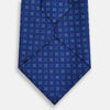 View 3 of product The Turnbull & Asser Blue Multi Dot Silk Tie features a rolled-up blue design with small light blue dots, offering an elegant, refined accent to office attire.
