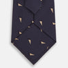 View 3 of product The Navy Triangle Silk Tie by Turnbull & Asser features an elegant gold micro triangle pattern on navy silk, making it a sophisticated accessory that pairs perfectly with Turnbull & Asser shirts.