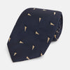 View 1 of product The Navy Triangle Silk Tie by Turnbull & Asser features an elegant gold micro triangle pattern on navy silk, making it a sophisticated accessory that pairs perfectly with Turnbull & Asser shirts.