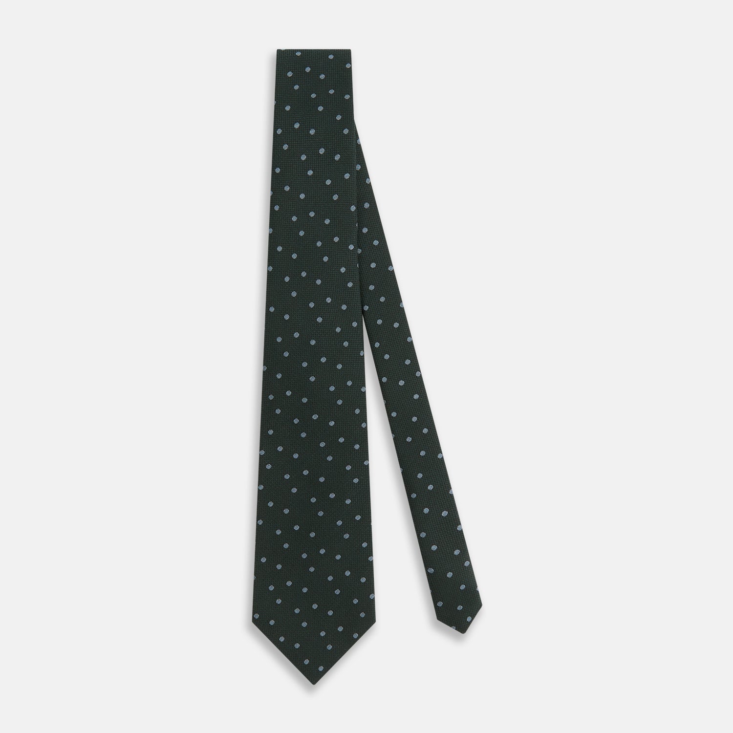 View 2 of product The Turnbull & Asser Pale Blue and Green Micro Dot Silk Blend Tie, shown rolled on a white background, is ideal for complementing your favorite shirts.