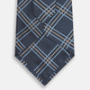 View 3 of product The Turnbull & Asser Navy Triple Check Silk Tie features a light blue and white plaid pattern—an essential accessory for the modern gentleman and a perfect complement to any Turnbull & Asser shirt.