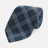 View 1 of product The Turnbull & Asser Navy Triple Check Silk Tie features a light blue and white plaid pattern—an essential accessory for the modern gentleman and a perfect complement to any Turnbull & Asser shirt.