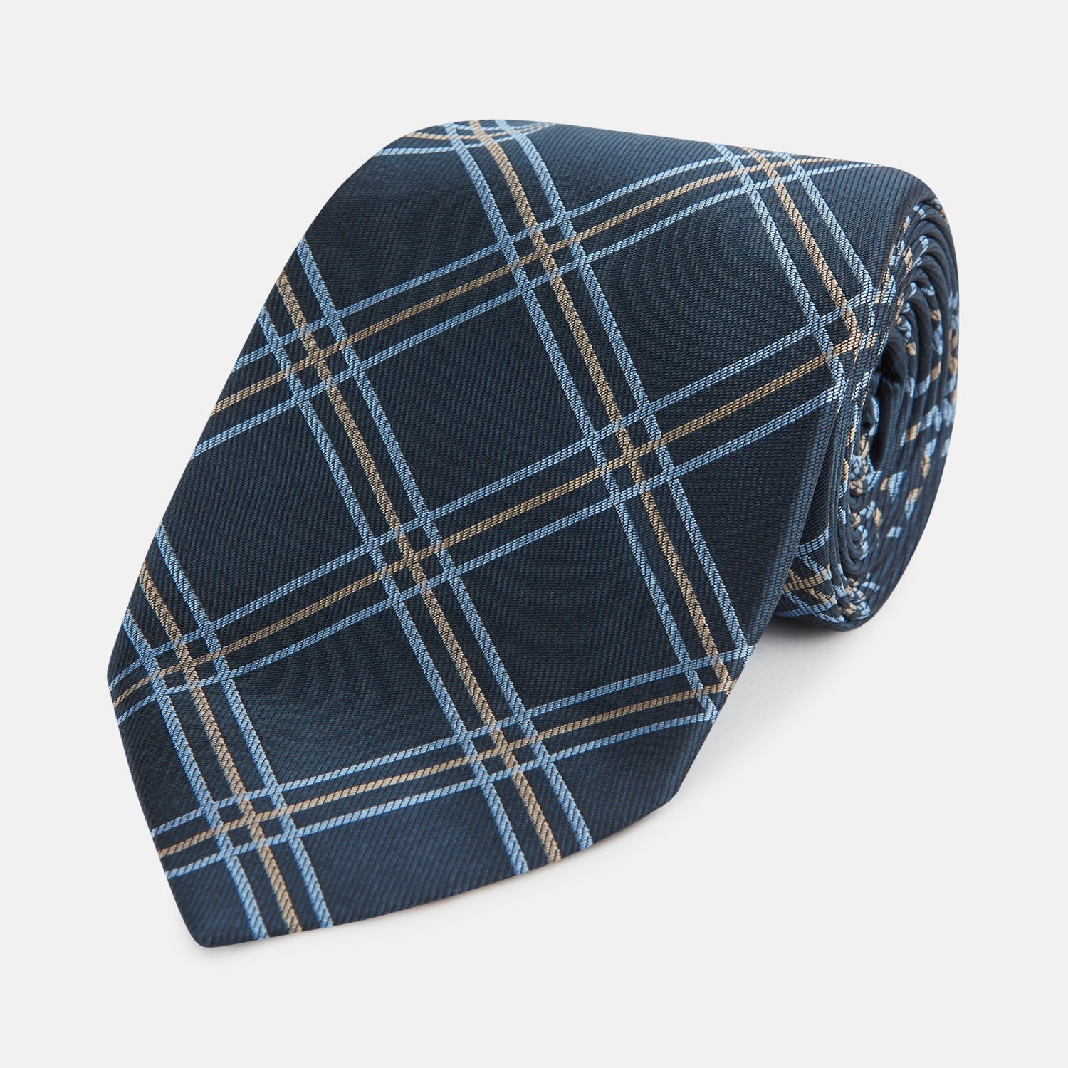 View 1 of product The Turnbull & Asser Navy Triple Check Silk Tie features a light blue and white plaid pattern—an essential accessory for the modern gentleman and a perfect complement to any Turnbull & Asser shirt.