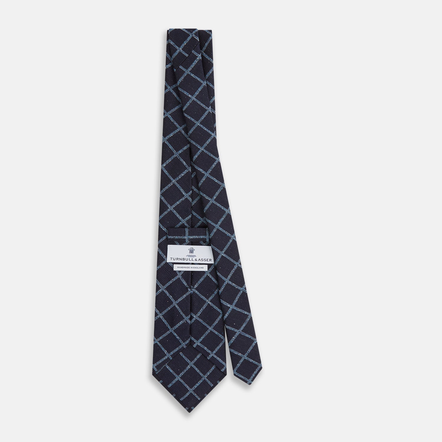 View 4 of product The Blue Diagonal Check Silk Blend Tie by Turnbull & Asser features a navy and light blue check pattern—a crisp accent for your favorite shirts.