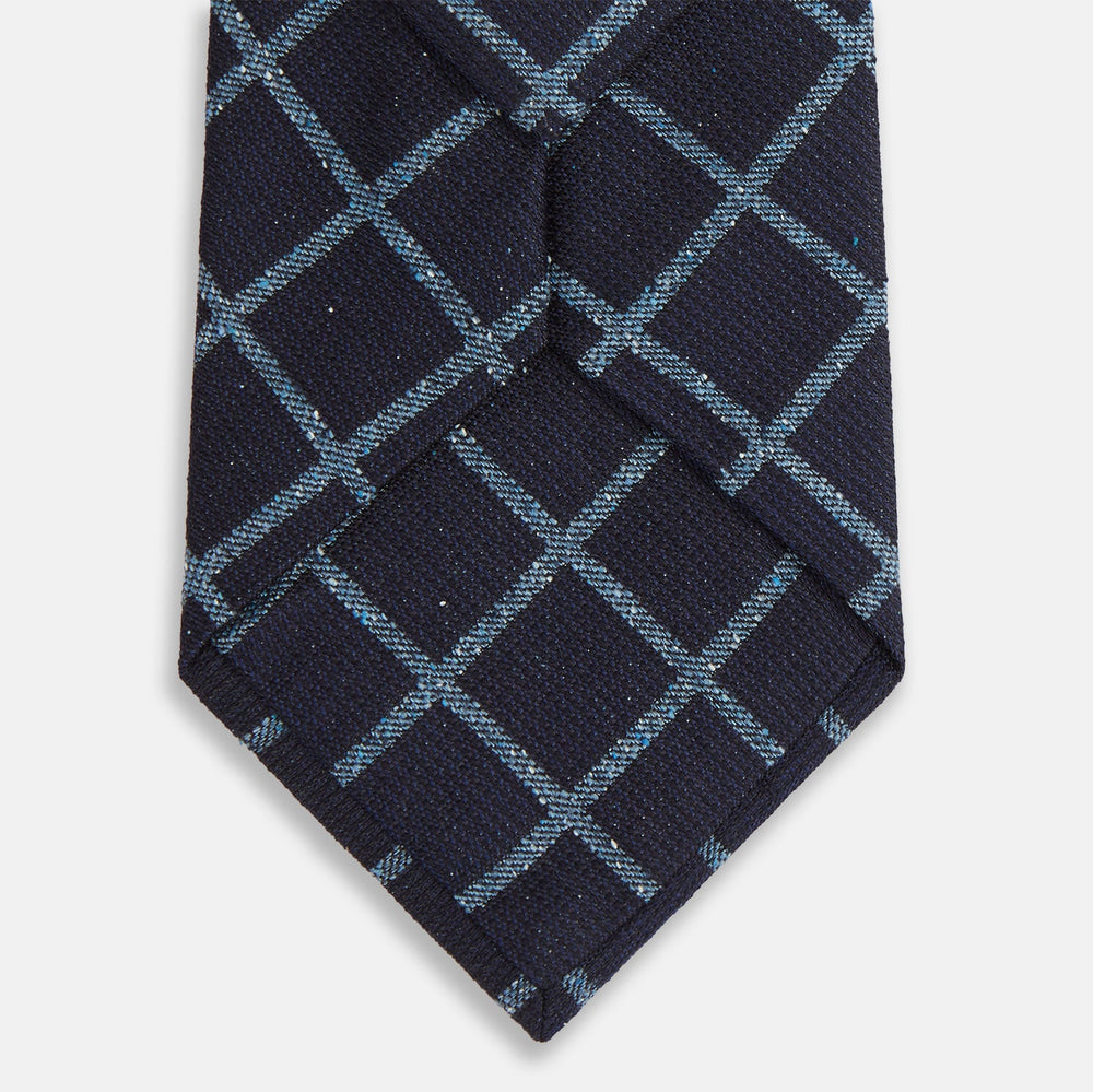 The Blue Diagonal Check Silk Blend Tie by Turnbull & Asser features a navy and light blue check pattern—a crisp accent for your favorite shirts.