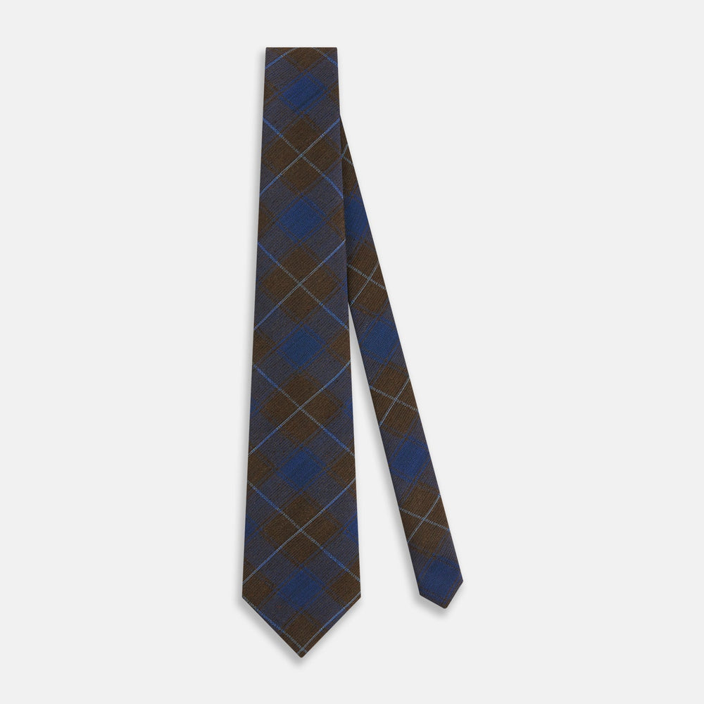 The Turnbull & Asser Blue and Brown Tartan Silk Blend Tie, rolled up to show intersecting patterns, is displayed against a plain white background.