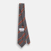 View 4 of product The Turnbull & Asser Red Block Stripe Silk Tie, featuring bold red stripes, is an elegant men's accessory displayed on a plain white background.