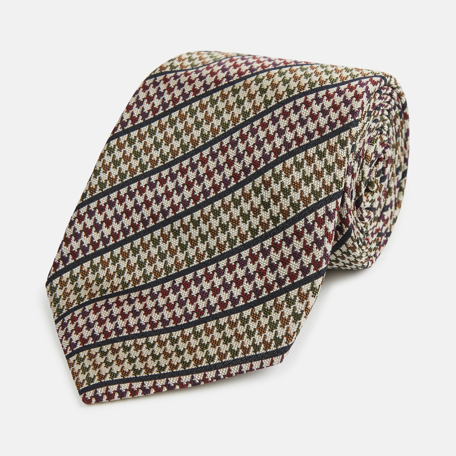 View 1 of product The Turnbull & Asser Brown Puppytooth Stripe Silk Tie features a brown, burgundy, and cream houndstooth pattern with black and white diagonal stripes—ideal for pairing with Turnbull & Asser shirts.