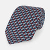 View 1 of product The Turnbull & Asser UK TIES 9.5CM GEOMETRIC RECTANGLES RED is an English silk tie with small red, navy blue, and white rectangles and dots on a white background.