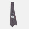 View 4 of product The Turnbull & Asser UK TIES 9.5CM GEOMETRIC RECTANGLES RED is an English silk tie with small red, navy blue, and white rectangles and dots on a white background.
