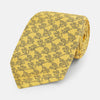 View 1 of product The Turnbull & Asser UK Yellow Floral Jigsaw Printed Silk Tie is neatly rolled to showcase its vibrant yellow hue and intricate floral jigsaw print.
