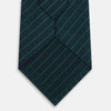 View 3 of product The Forest Green Beaded Ticking Stripe Silk Tie by Turnbull & Asser UK features diagonal blue stripes and is elegantly displayed on a plain white background.