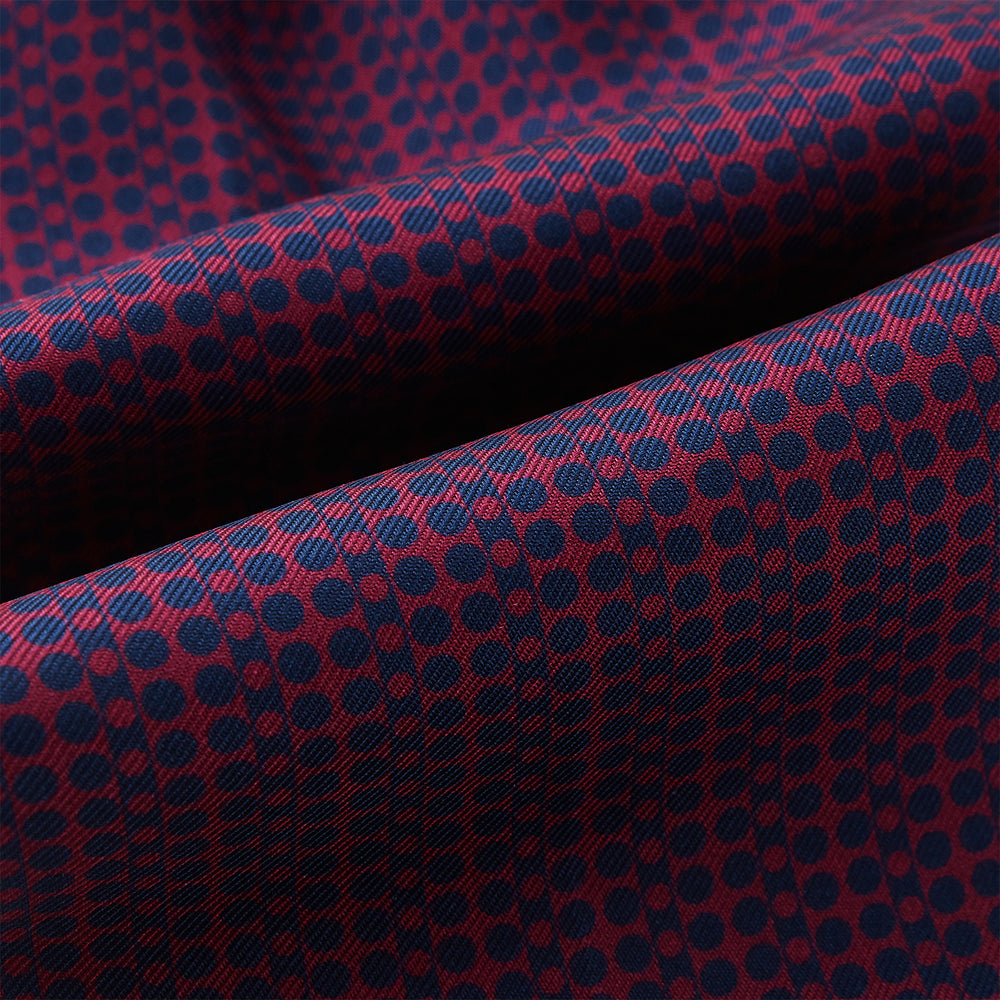 The Burgundy Micro-Dot Bar Printed Silk Cravat by Turnbull & Asser UK features a British style with a navy background, vertical red dots, and diagonal burgundy and navy stripes.