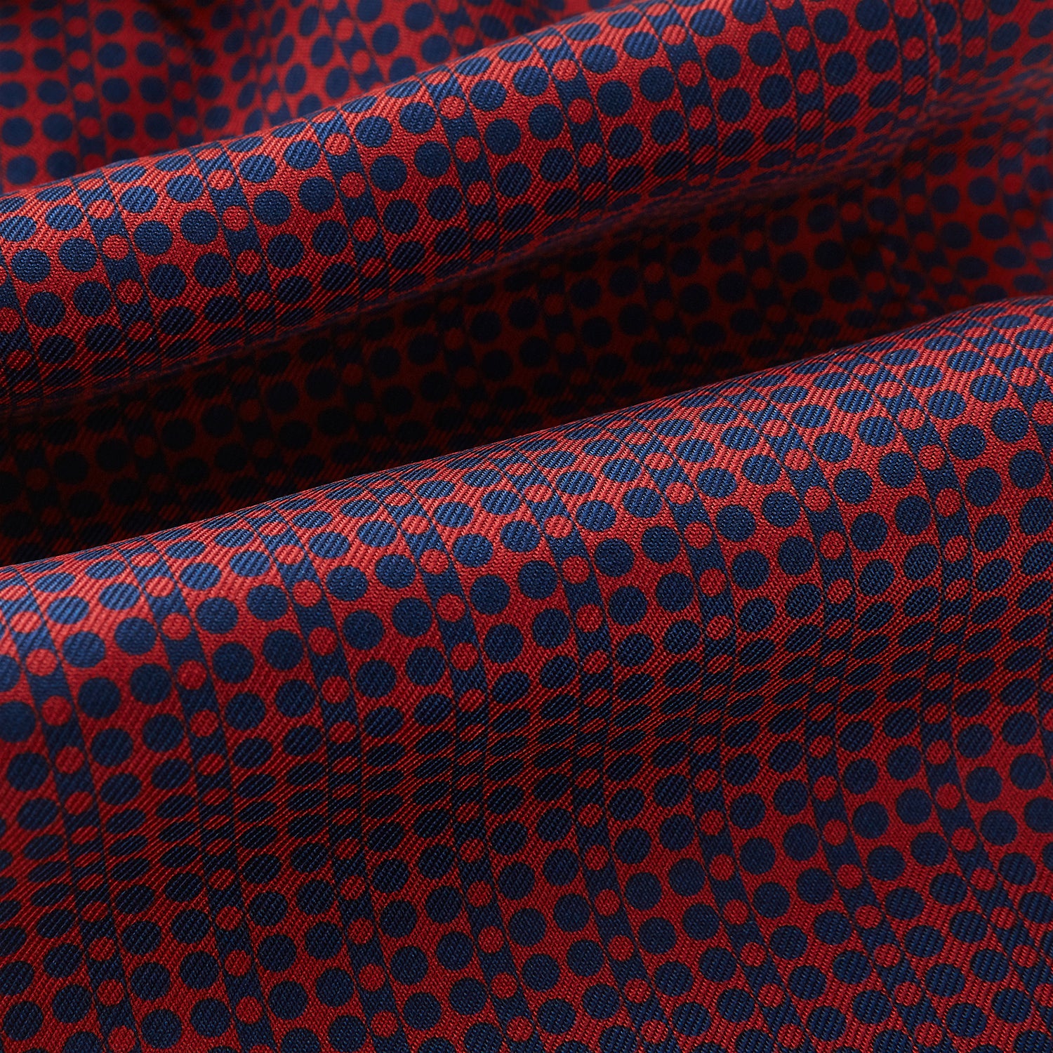 View 4 of product The Red Micro-Dot Bar Printed Silk Cravat from Turnbull & Asser UK features a geometric red and navy micro-dot pattern—a refined accessory inspired by classic British style, perfect for elegant weddings.
