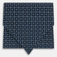 A folded Geometric Navy Quatrefoil Motif Ascot Tie in Silk, featuring a navy ground with a white grid pattern and small quatrefoil motifs in each square.