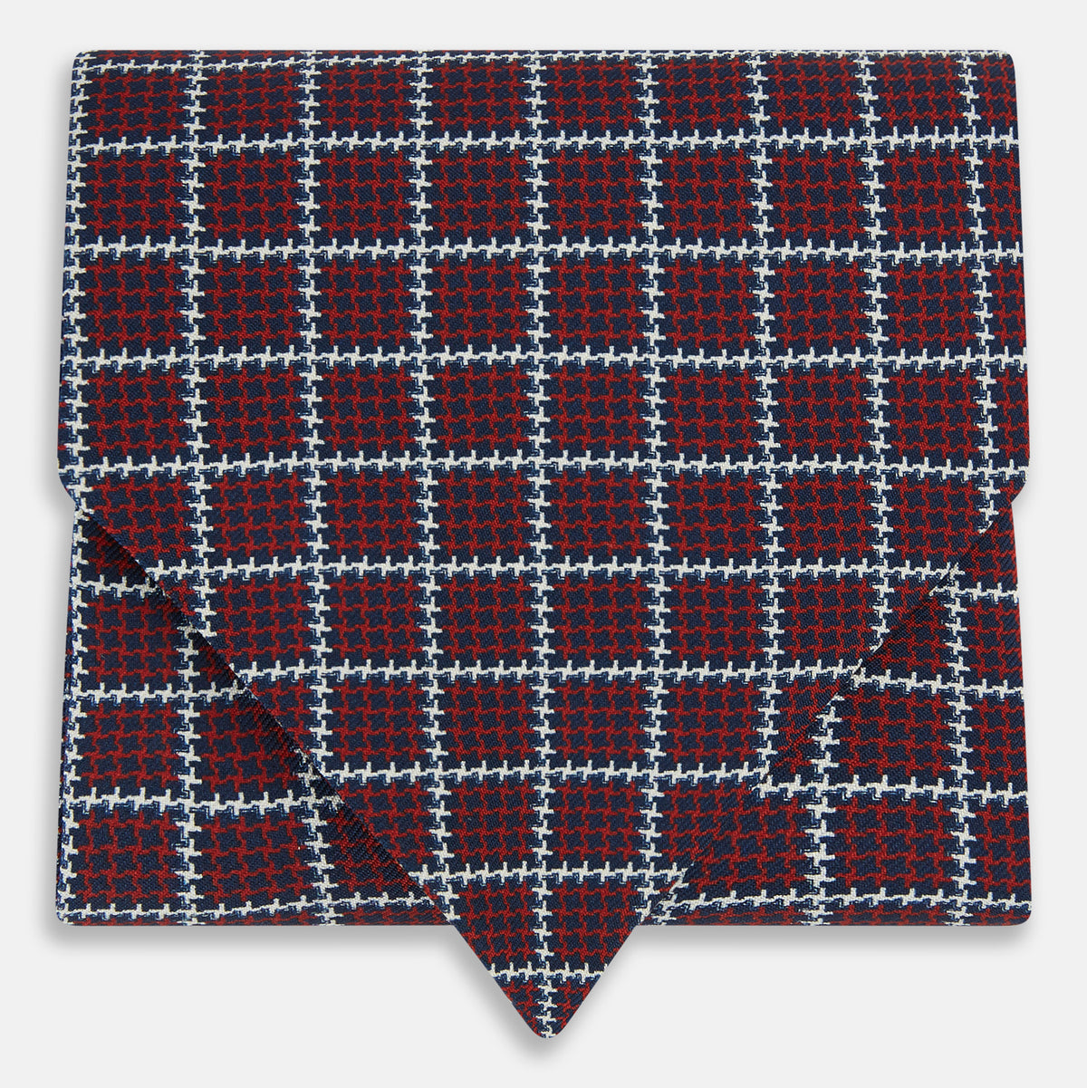 View 1 of product Turnbull & Asser UK Houndstooth Red Ascot Tie in Silk, featuring a folded design in red and navy houndstooth with a white grid overcheck.